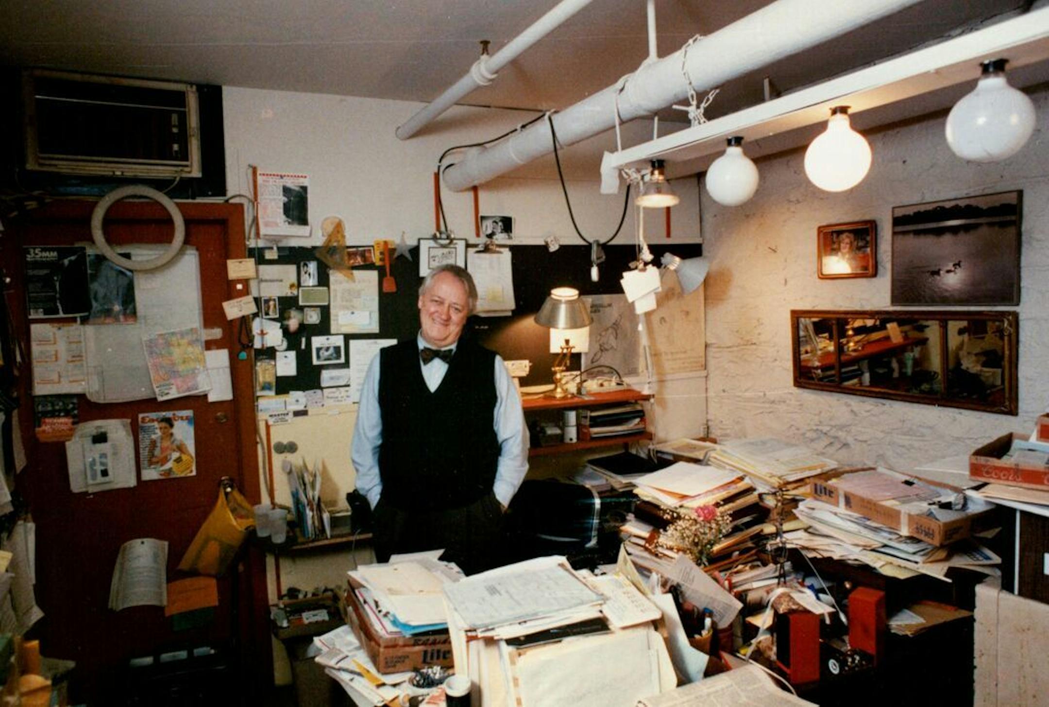 January 1990: "Because Dudley Riggs is torn between his business and artistic duties, his office reflects that angst. 'Well, you know, it's not a good idea. I end up with recipes, scripts and receipts all.'"