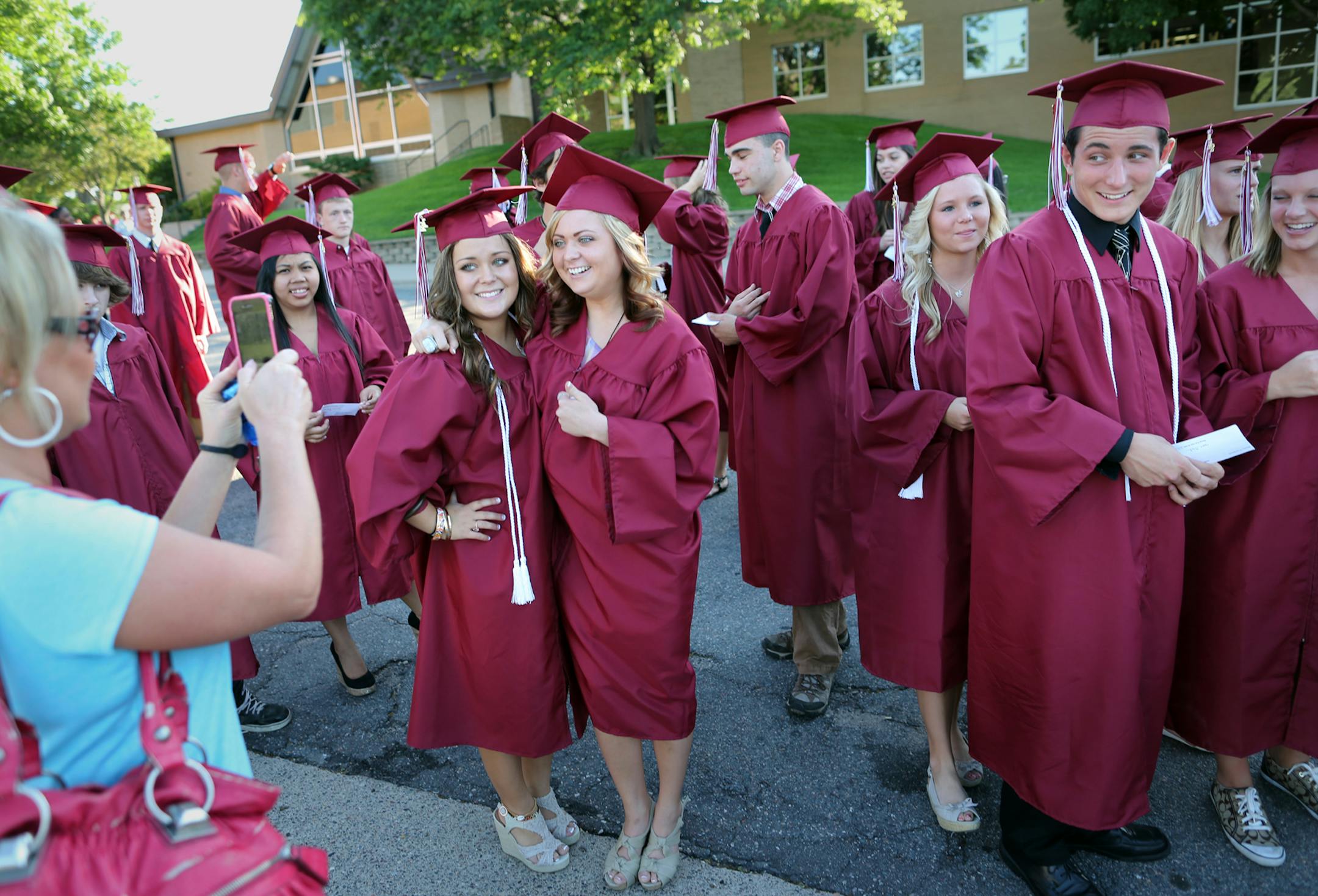 In this June 2012 file photo, seniors at Anoka High School prepare for their graduation ceremony.