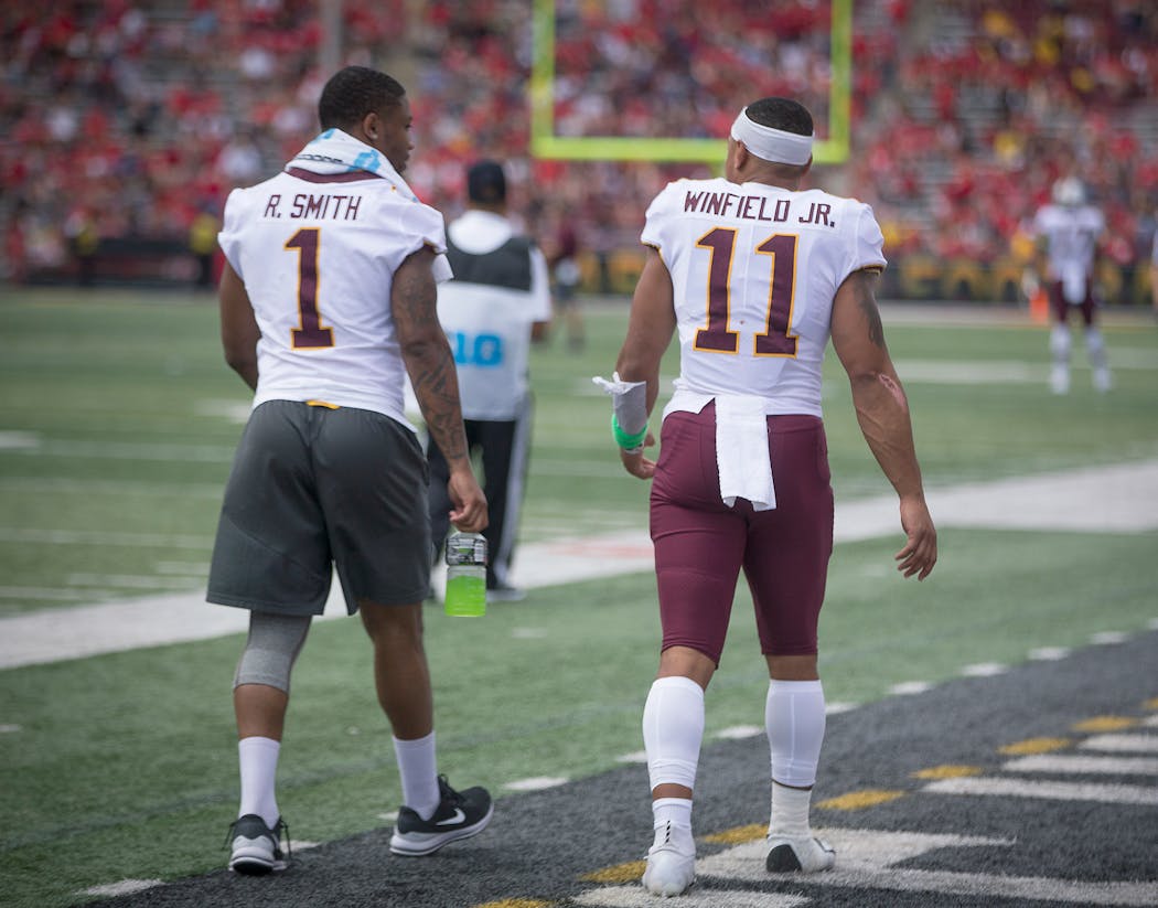 Running back Rodney Smith and defensive back Antoine Winfield Jr., both injured, made their way to the sideline after halftime as the Gophers took on Maryland