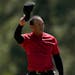 Tiger Woods tips his cap on the 18th green during the final round at the Masters golf tournament on Sunday, April 10, 2022, in Augusta, Ga. (AP Photo/