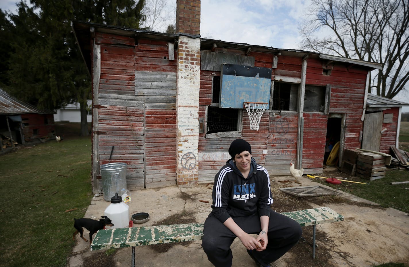 The hoop on the coop: Lynx center Janel McCarville found a seat near the basketball hoop attached to her family farm's chicken coop outside of Stevens Point, Wis. The hoop, now hung low to benefit her brothers' children, was put up when McCarville was 13 years old, and it helped make her the player she is today.