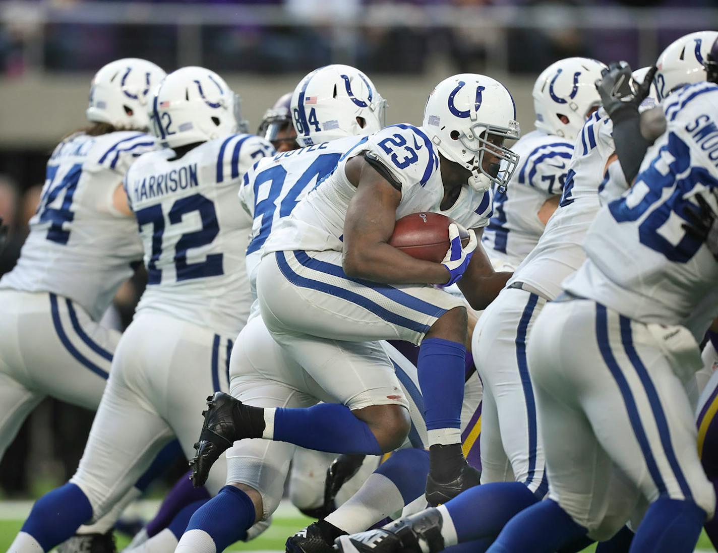 Indianapolis Colts running back Frank Gore (23) squeezed through an opening during a fourth quarter carry for a six yard gain.