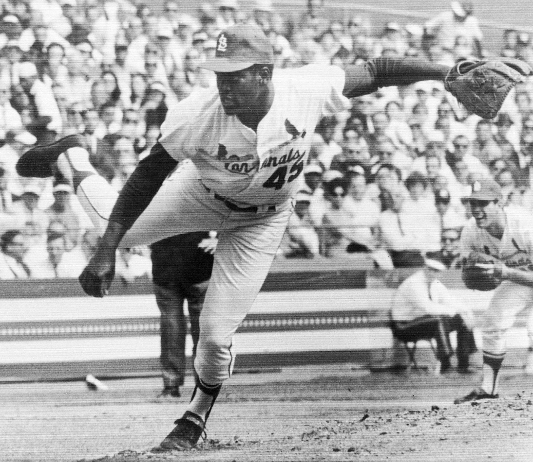 Bob Gibson of the St. Louis Cardinals fires the ball in the first game of the World Series against the Detroit Tigers at Busch Stadium in St. Louis, Mo., Oct. 2, 1968. (AP Photo) ORG XMIT: APHS455990