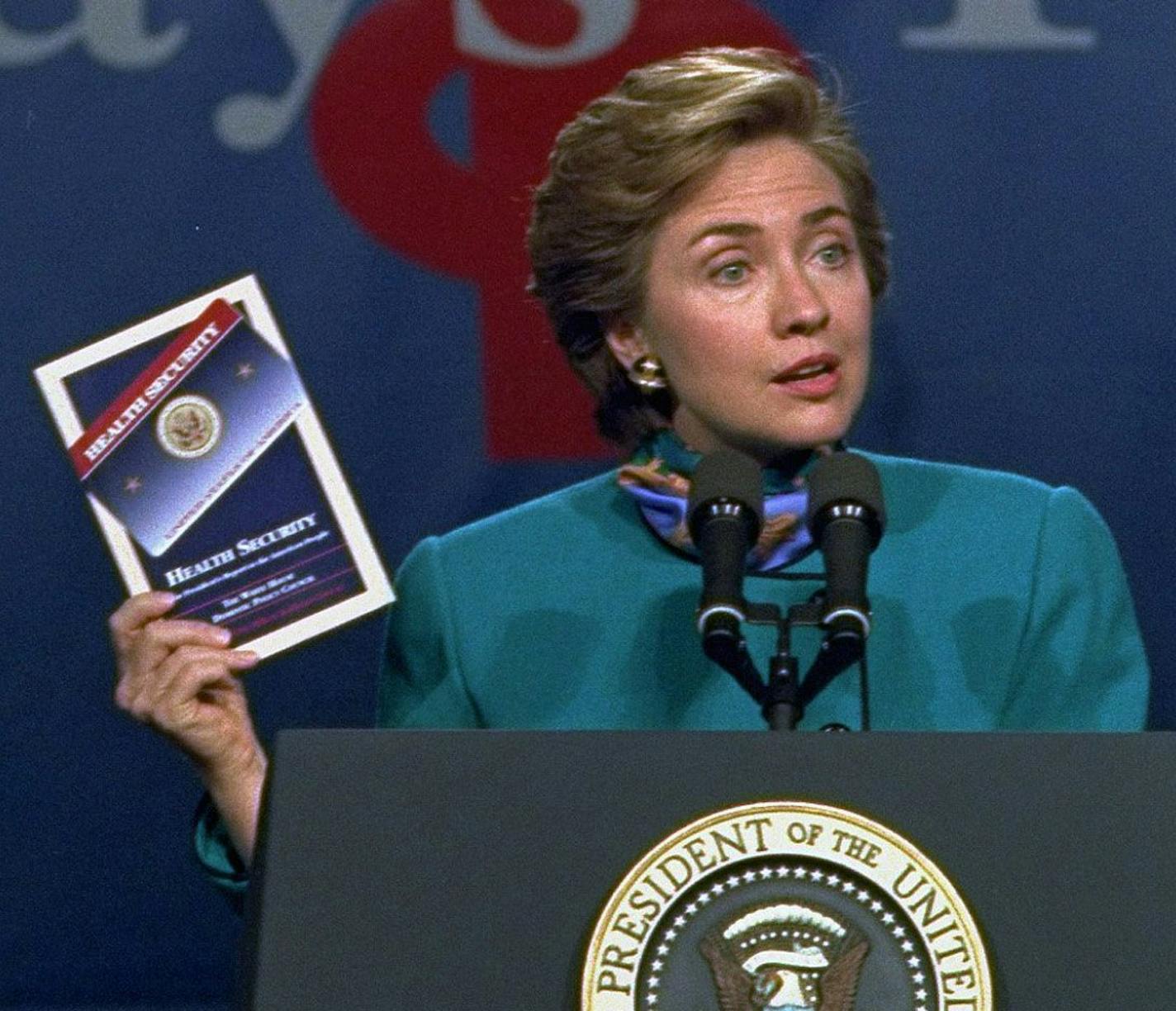 ** FILE ** Then first lady Hillary Rodham Clinton, holding a copy of the Clinton health-care plan, kicks off a three-state sales campaign during a visit to the Johns Hopkins University in Baltimore in this Oct. 28, 1993 file photo. In the years since the proposal, wary presidential candidates at first avoided the issue altogether, then only gingerly approached the subject. This year, no self-respecting presidential candidate wants to be without a health-care reform plan, and talk about "universa