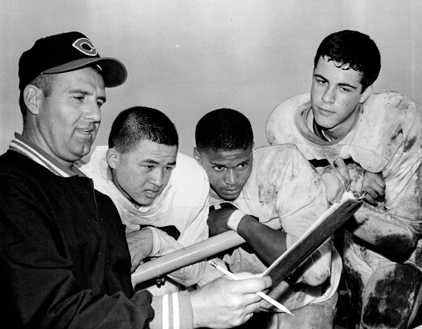 September 6, 1963 Central Eleven Shows Experience, Power in Line, Backfield Coach Chuck Elias (left), quarterback Greg wong, tackles Emerson Carr, Mike Sutter September 4, 1963 John Croft, Minneapolis Star Tribune