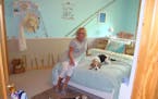 Beth Meyers in her beach room with her beagles.