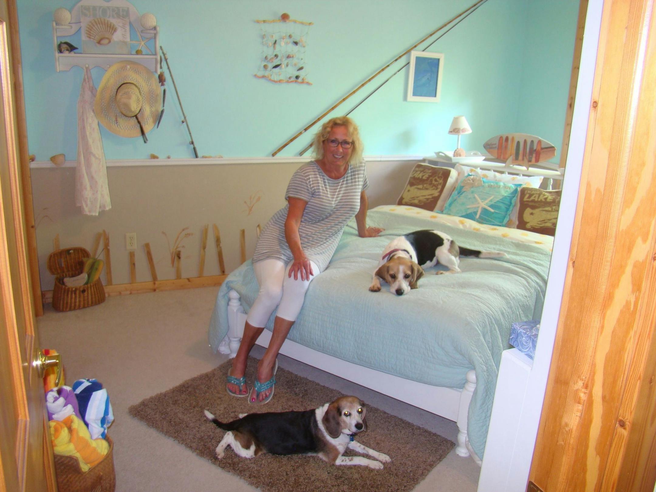 Beth Meyers in her beach room with her beagles.