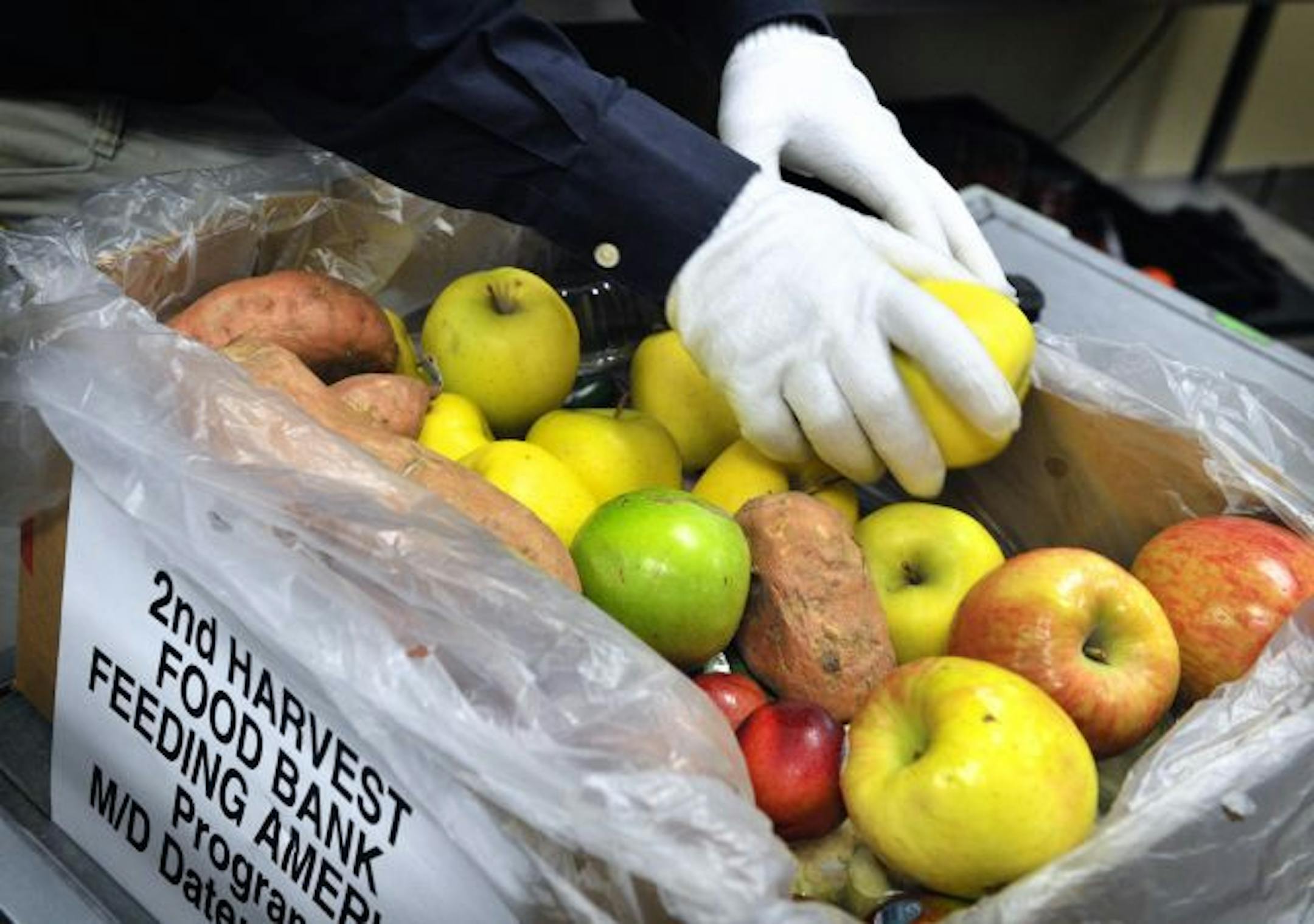 Produce associate Tricia Goodman selected produce at the Shakopee Wal-Mart destined for area food shelves.