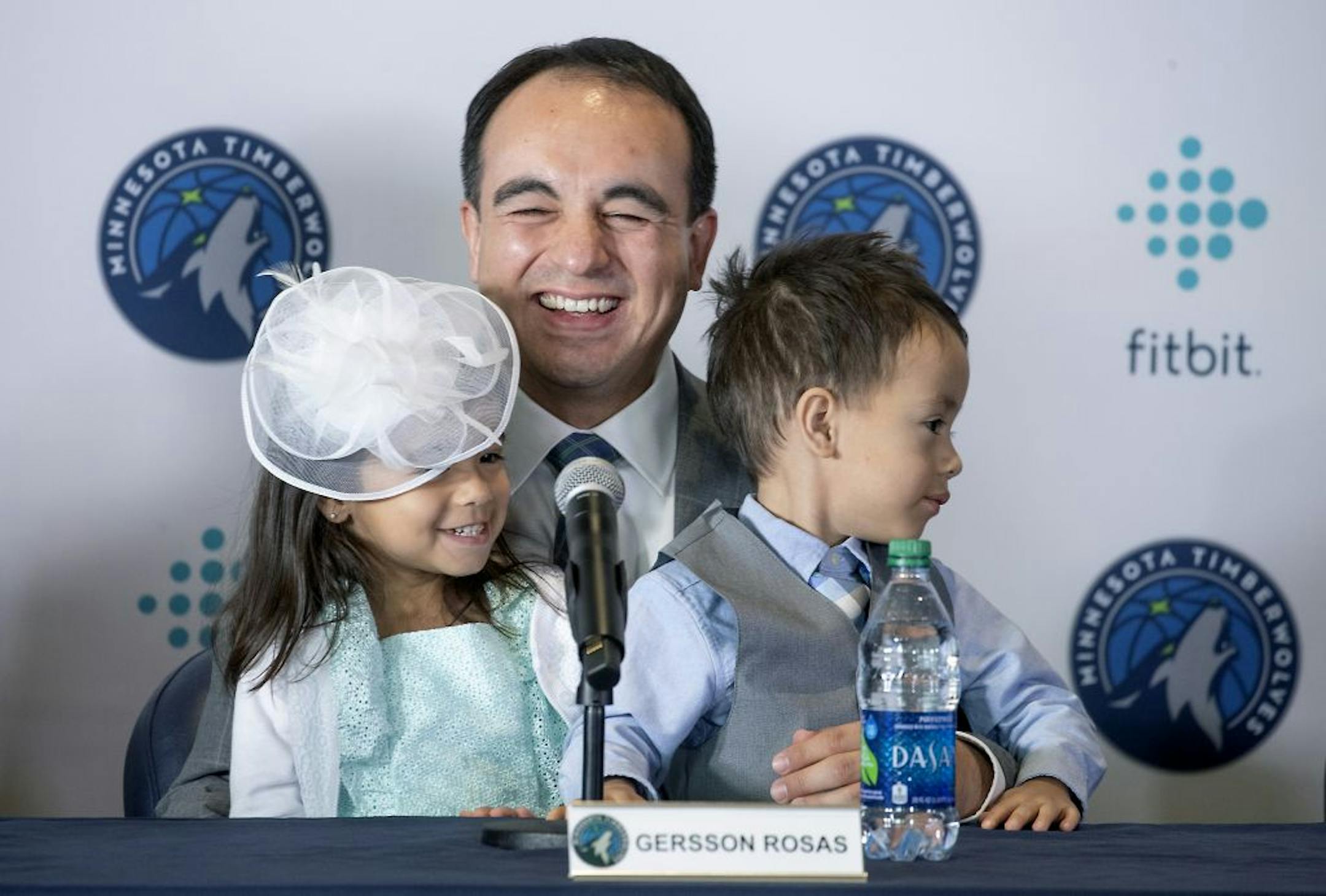 Minnesota Timberwolves new President of basketball operations Gersson Rosas laughed as his 3-year-old twins Giana, left, and Grayson took over the microphone as he addressed the media during a press conference at the Target Center, Monday, May 6, 2019.