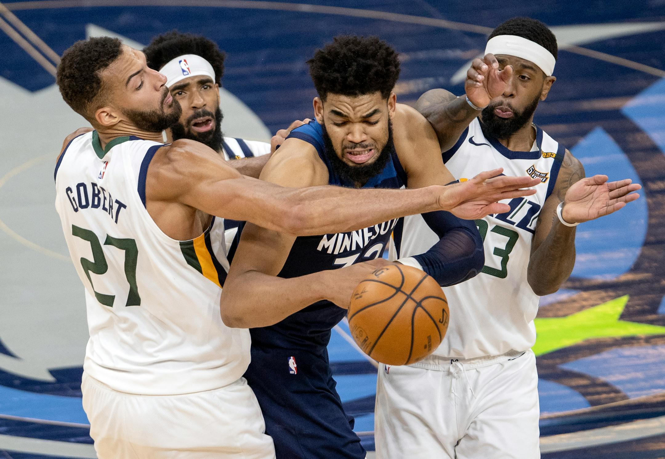 Karl-Anthony Towns (32) of the Minnesota Timberwolves was fouled by Rudy Gobert (27) of the Utah Jazz in the fourth quarter.