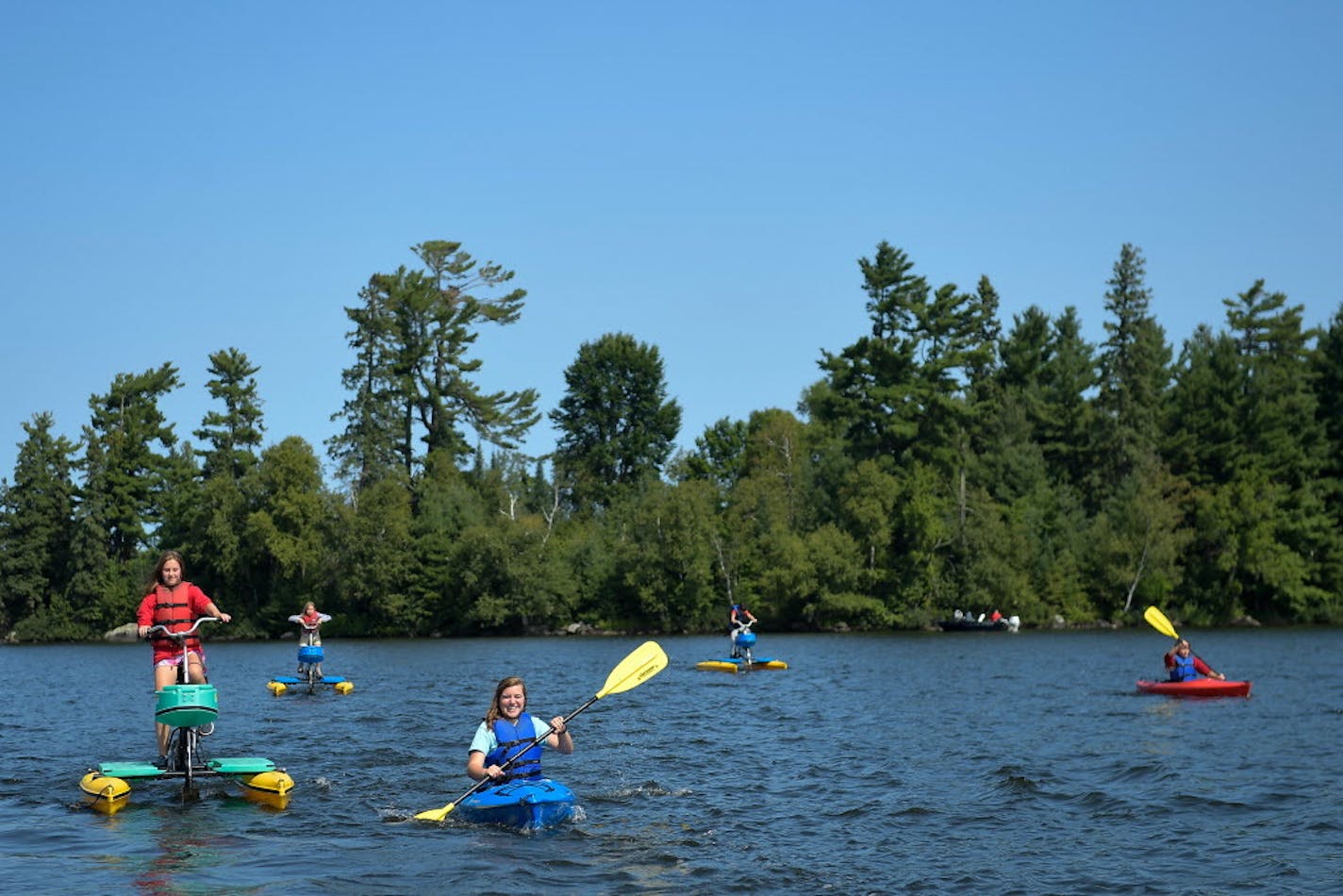 Pehrson Lodge Resort seasonal employee Alexis Luedtke, left of center, led a group of kids on an afternoon outing on Lake Vermilion on Thursday, August 24, 2017. ] AARON LAVINSKY � aaron.lavinsky@startribune.com Feature on Pehrson Lodge Resort on Lake Vermilion, one of Minnesota's premier sailing destinations. Photographed in late August, 2017.