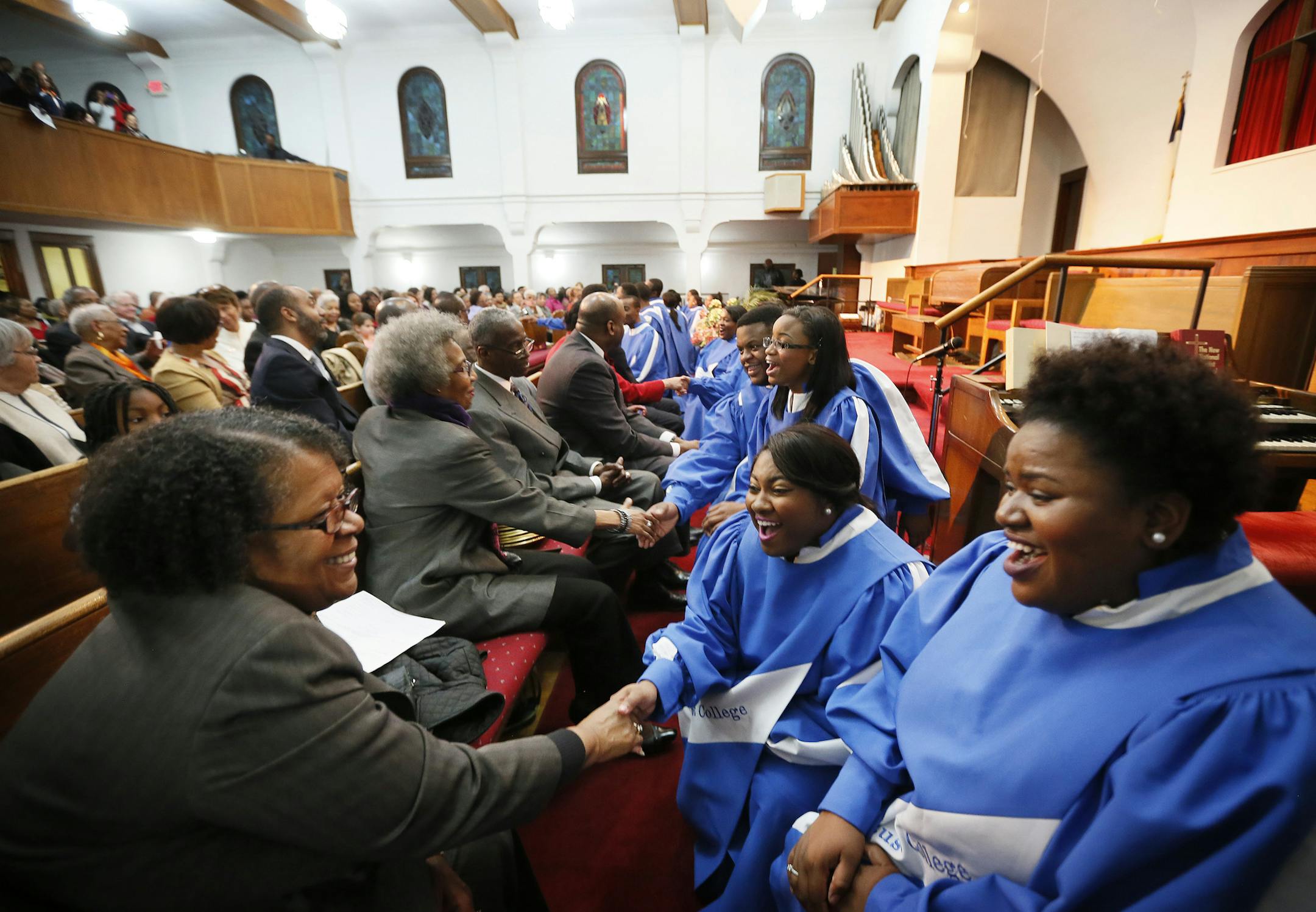 Dorothy Barnes-Griswold left shook hands with Amber Whitaker , and Crystal Bradley at Pilgrim Baptist Church in St. Paul Wednesday Monday April 22, 2015 .Rust College Choir is one of America most renowned choirs which features broad repertoire of classical semi-classical, spirituals, opera , contemporary and traditional gospel. The event was sponsored by the St. Paul Black Interdenominational Ministerial Alliance . ] Jerry Holt/ Jerry.Holt@Startribune.com