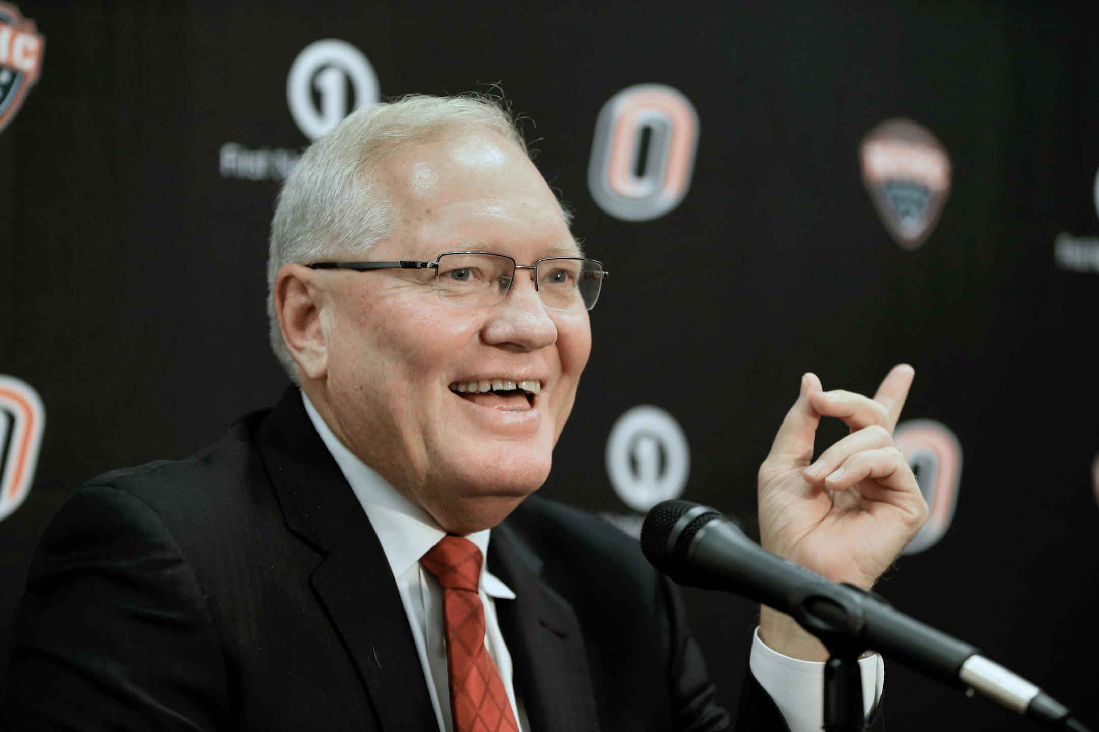 FILE- In this Oct. 6, 2015, file photo, Omaha coach Dean Blais smiles during the school's annual NCAA college hockey media day in Omaha, Neb. Coach Blais announced Tuesday, March 14, 2017, he will step down after eight seasons. (AP Photo/Nati Harnik, File)