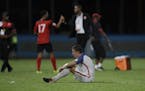 United States' Matt Besler, squats on the pitch after losing 2-1 against Trinidad and Tobago during a 2018 World Cup qualifying soccer match in Couva,