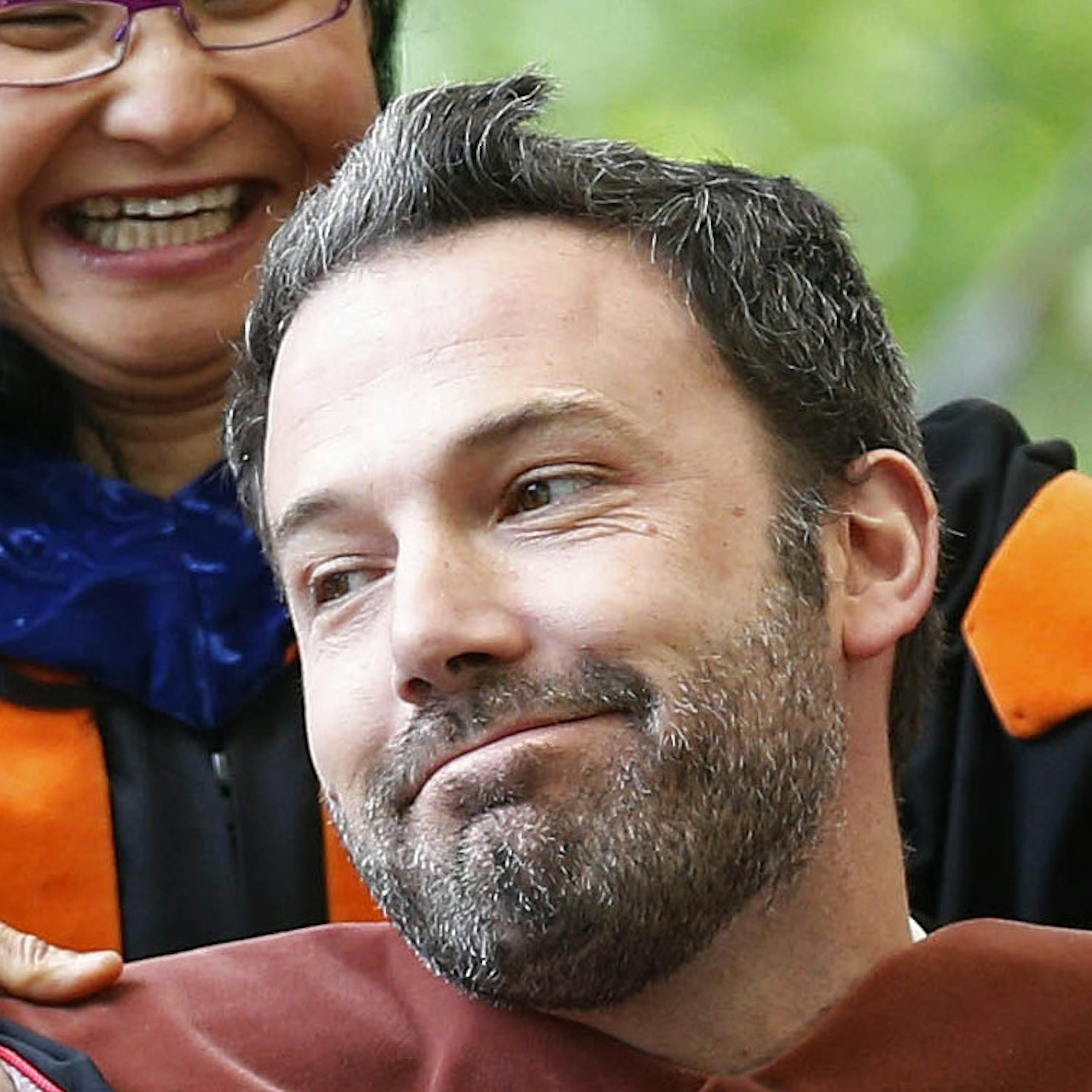 Actor and director Ben Affleck reacts as he receives an honorary degree at Brown University's commencement in Providence, R.I., Sunday, May 26, 2013. (AP Photo/Michael Dwyer) ORG XMIT: MIN2013052812084478