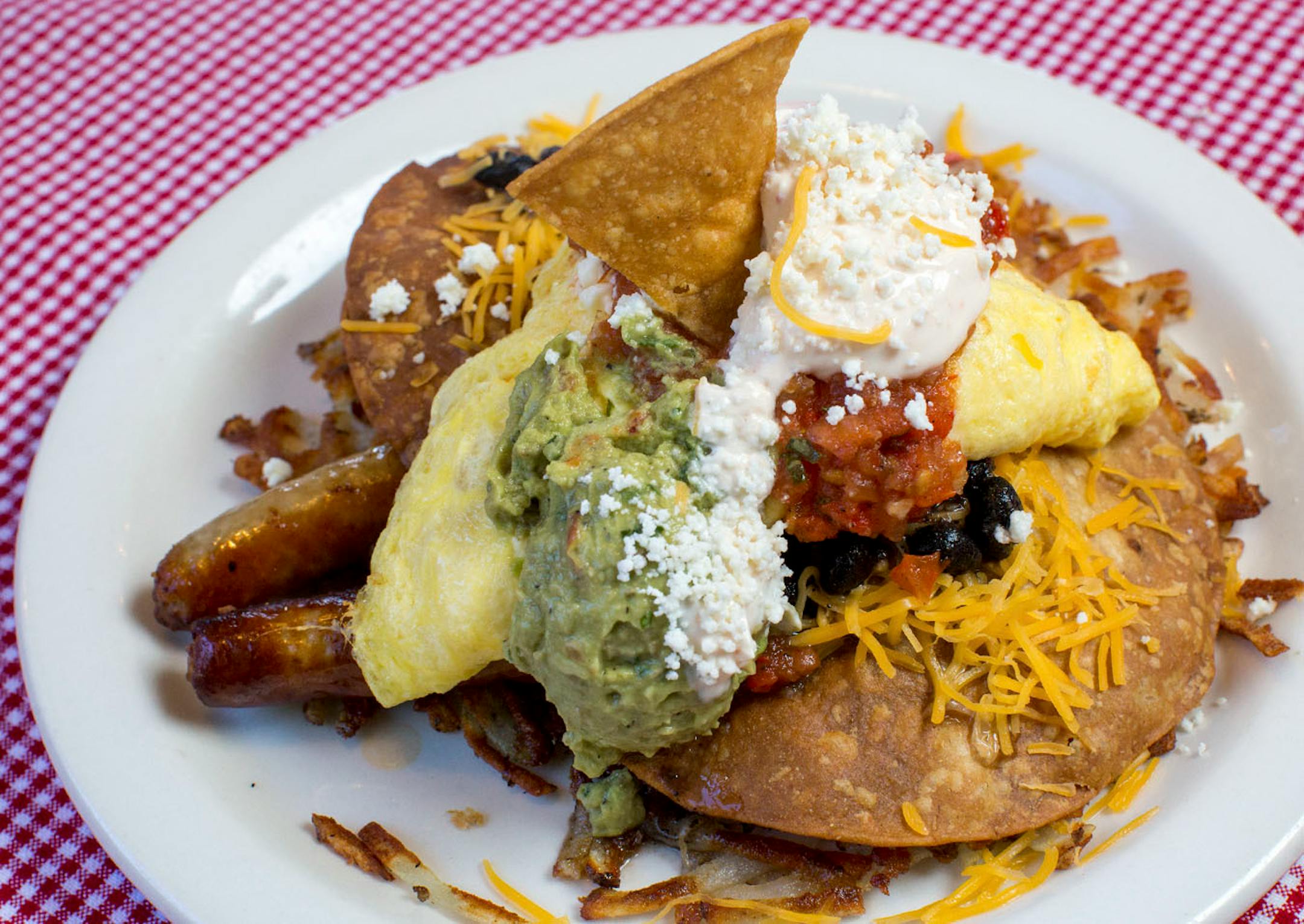 Homemade Cafe in Pepin serves their Mexican breakfast with eggs, tostadas, cheese, black beans, salsa, chipotle sour cream, guacamole, sausage and hash browns. ] COURTNEY PEDROZA • courtney.pedroza@startribune.com June 22-24, 2017; Wisconsin restaurants, cafes, bars, bakeries and breweries; Dining along the Mississippi River.