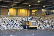 Piles of trash are collected on the tipping floor and loaded onto a conveyor belt for compost bag identification and separation on Nov. 9, 2023, at Ra