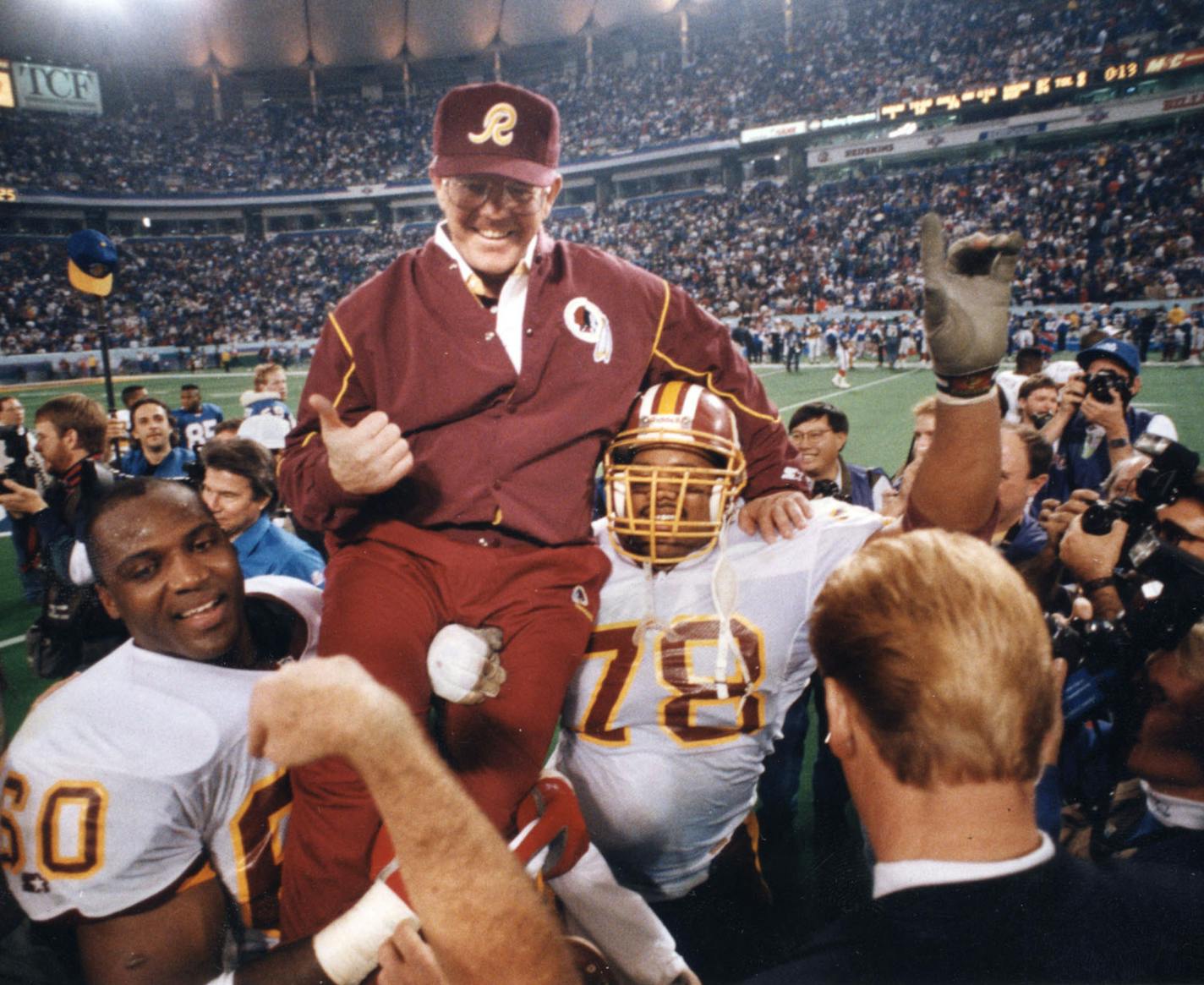 Members of the Washington Redskins pro football team carried coach Joe Gibbs off the Metrodome (Minneapolis) field after the 1992 Super Bowl.