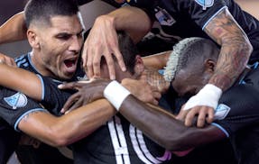 Minnesota United players celebrate with Brent Kallman (14) after his goal in the first half Tuesday, September 13, 2022, at Allianz Field in St. Paul,