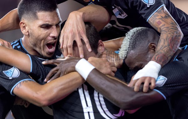 Minnesota United players celebrate with Brent Kallman (14) after his goal in the first half Tuesday, September 13, 2022, at Allianz Field in St. Paul,