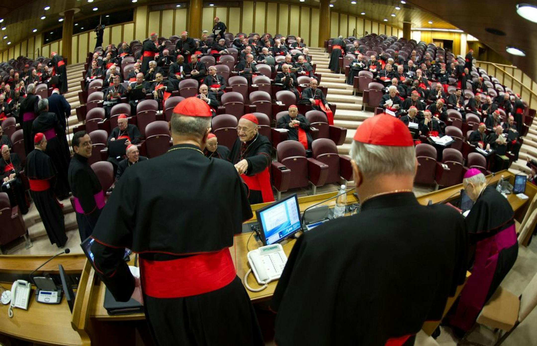 In this photo provided by the Vatican newspaper L'Osservatore Romano, cardinals attend a meeting, at the Vatican, Monday, March 4, 2013. Cardinals from around the world have gathered inside the Vatican for their first round of meetings before the conclave to elect the next pope.