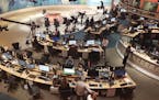 In this Thursday, June 8, 2017 photo, Al-Jazeera staff work at their TV station in Doha, Qatar. The Arab news network Al-Jazeera has been thrust into 