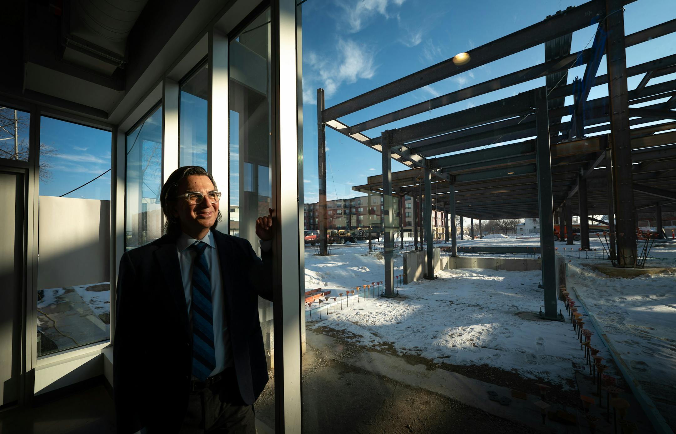 Patrick Seeb, new executive director of DMC, the Destination Medical Center.  Discovery Square 2 is inder construction in the background, right behind Discovery Square 1.