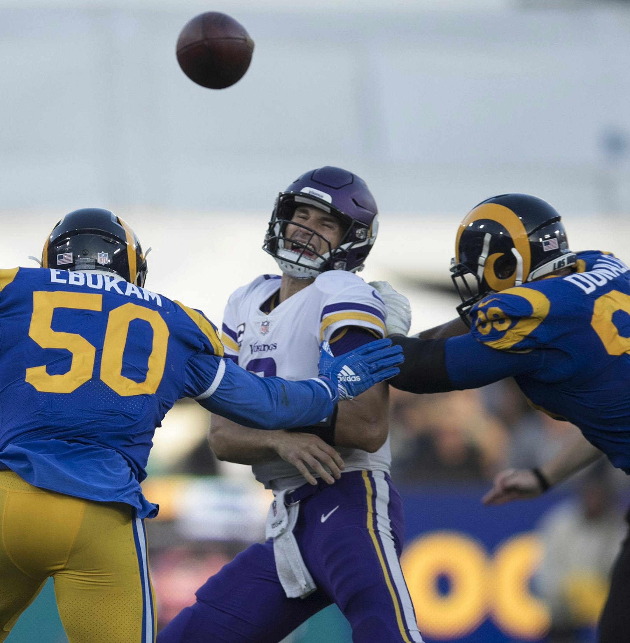 Minnesota Vikings quarterback Kirk Cousins (8) was hit by Los Angeles Rams defensive tackle Aaron Donald (99) in the second quarter , the pass was caught by Minnesota Vikings wide receiver Stefon Diggs (14) at the L.A. Memorial Coliseum Thursday September 27, 2018 in Los Angles, CA. ] The Los Angeles Rams hosted the Minnesota Vikings a the L.A. Memorial Coliseum . JERRY HOLT ï jerry.holt@startribune.com