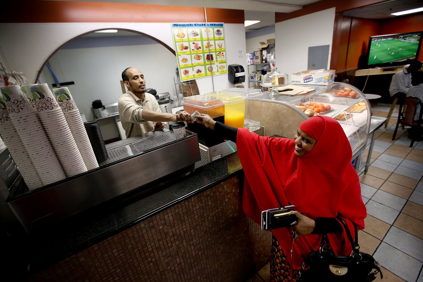 Farhan Osman waited on his customers at Nogob Coffee Shop inside a Somali mallon the corner of E. 24th Street and 10th Avenue S.