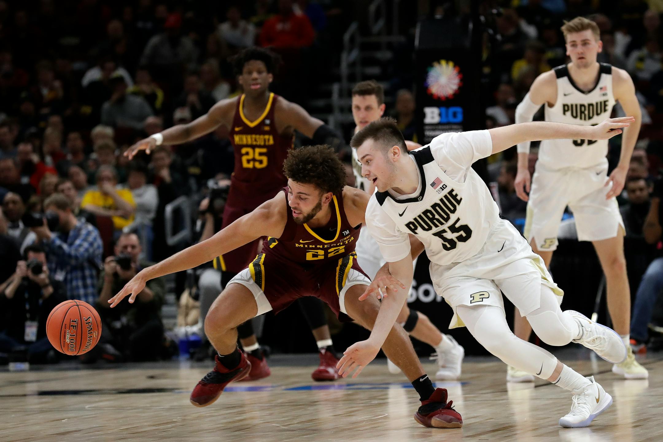 Gophers guard Gabe Kalscheur went for a loose ball with Purdue's Sasha Stefanovic on Friday, when Kalscheur shut down Boilermakers star Carsen Edwards.