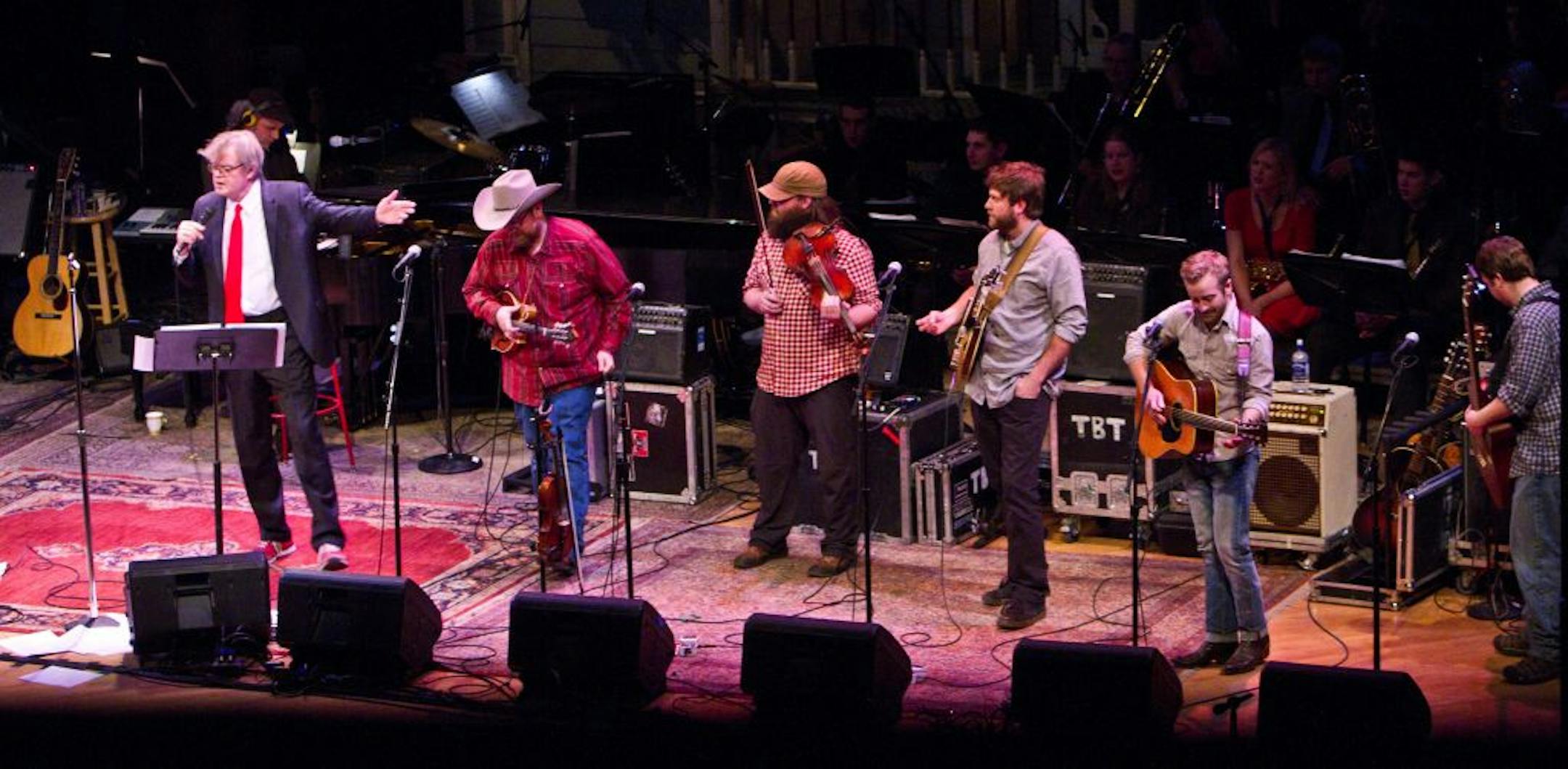 At Prairie Home Companion's Duluth broadcast Saturday, host Garrison Keillor introduced the members of Trampled by Turtles, who were the featured music guest. Left to right, Erik Berry (mandolin, vocals), Ryan Young (fiddle), Dave Carroll (banjo, vocals), Dave Simonett (guitar, lead vocals) and Tim Saxhaug (bass, vocals).