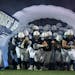 Members of the St. Francis football team take the field in St. Francis, Minn. on Wednesday October 19, 2022.
