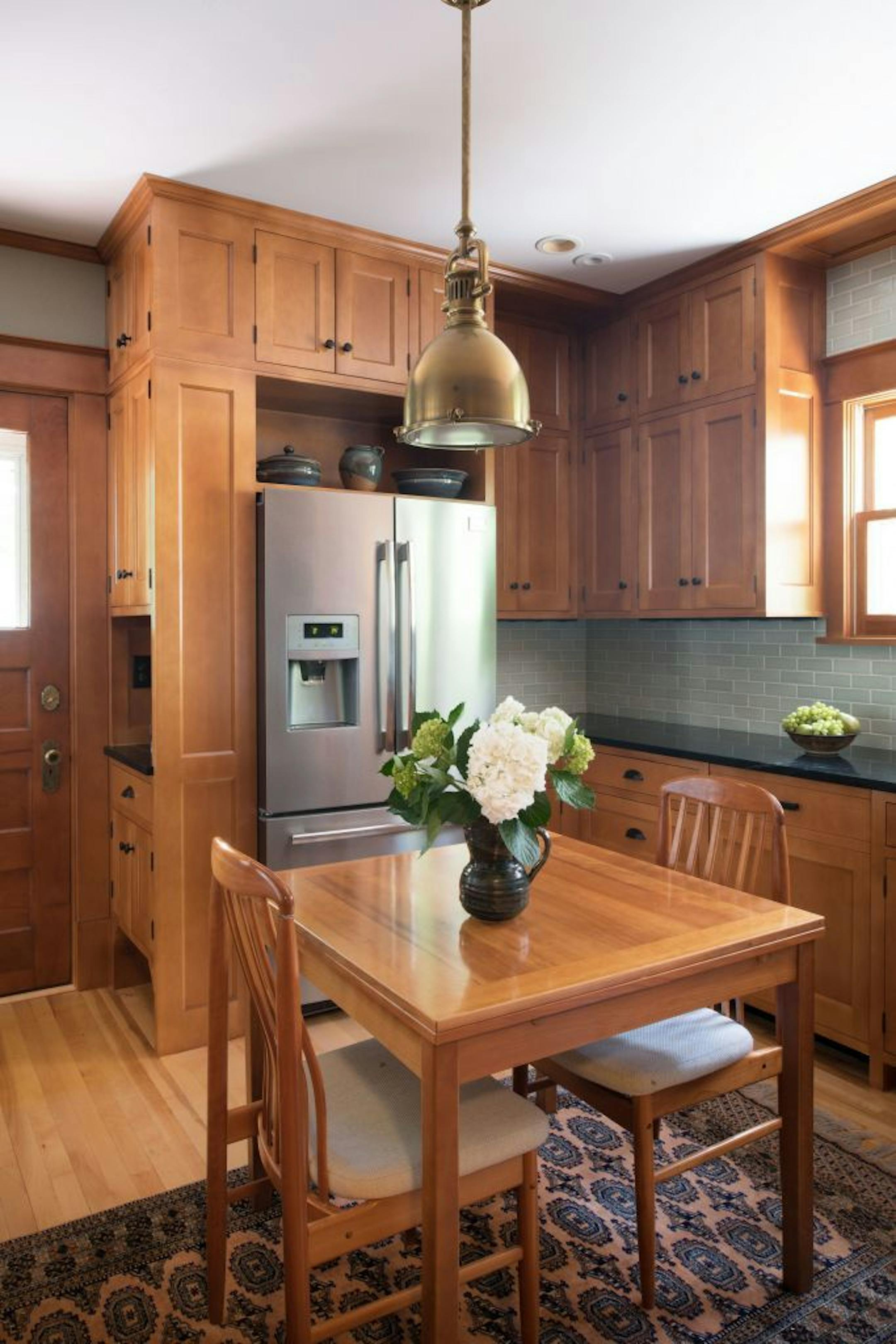 The new kitchen gets light from the sunroom.