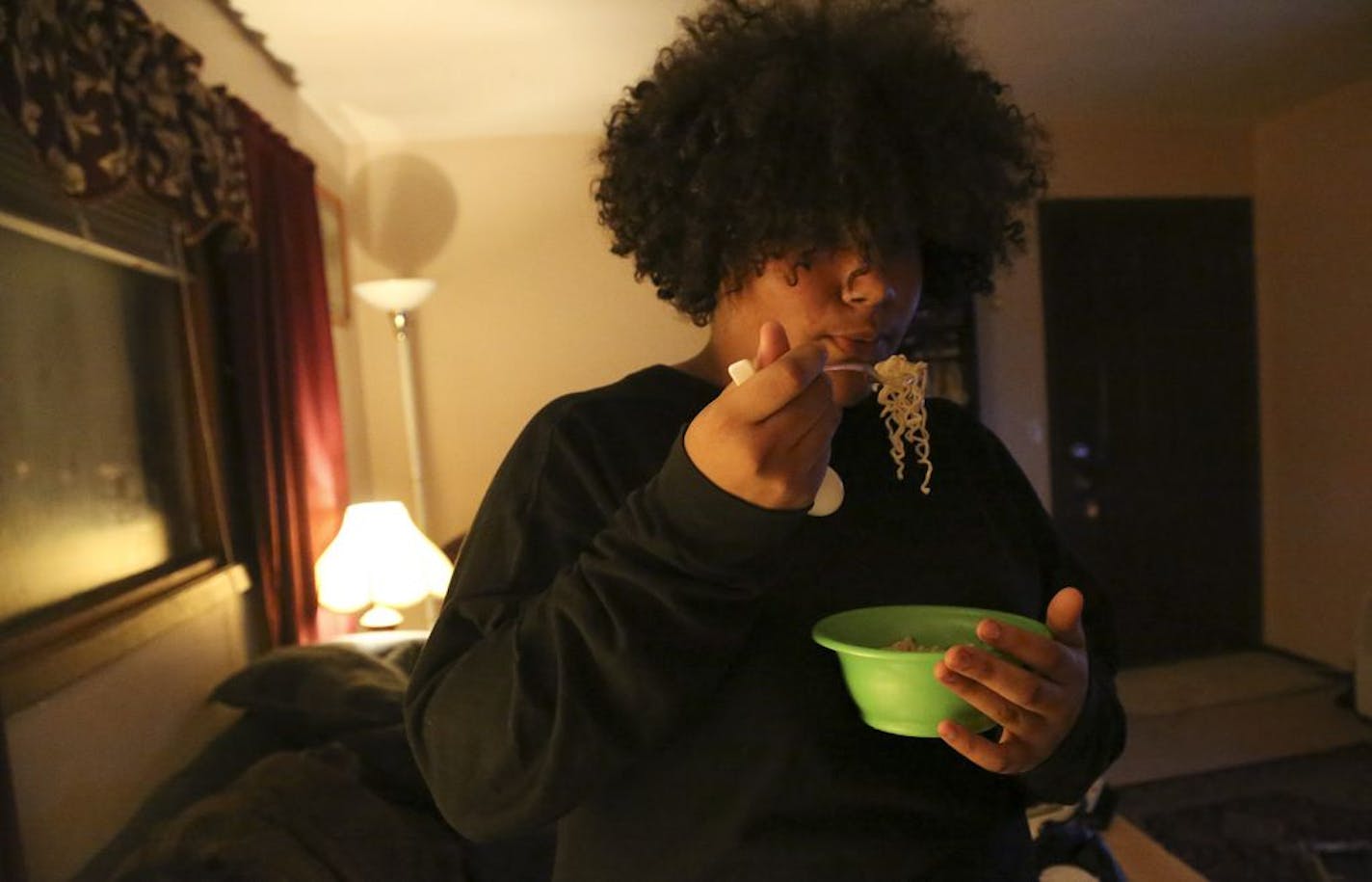 Lavon Swygert, 13, blew on a mouthful of Ramen noodles at her home in Anoka on Thursday. She has Type 2 diabetes and readily admits she doesn't often follow the dietary advice about healthy eating that her doctors give her.