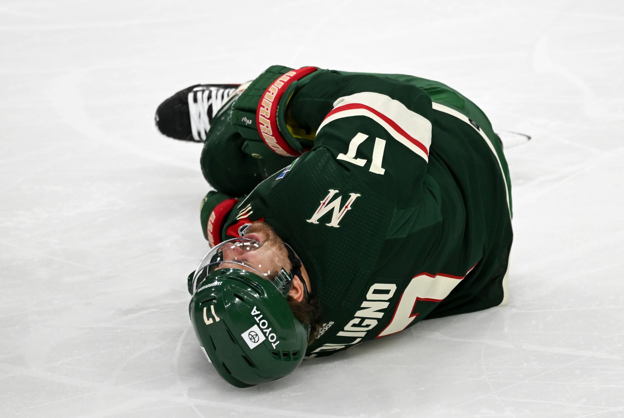 Minnesota Wild left wing Marcus Foligno (17) lays injured on the ice during the second period.