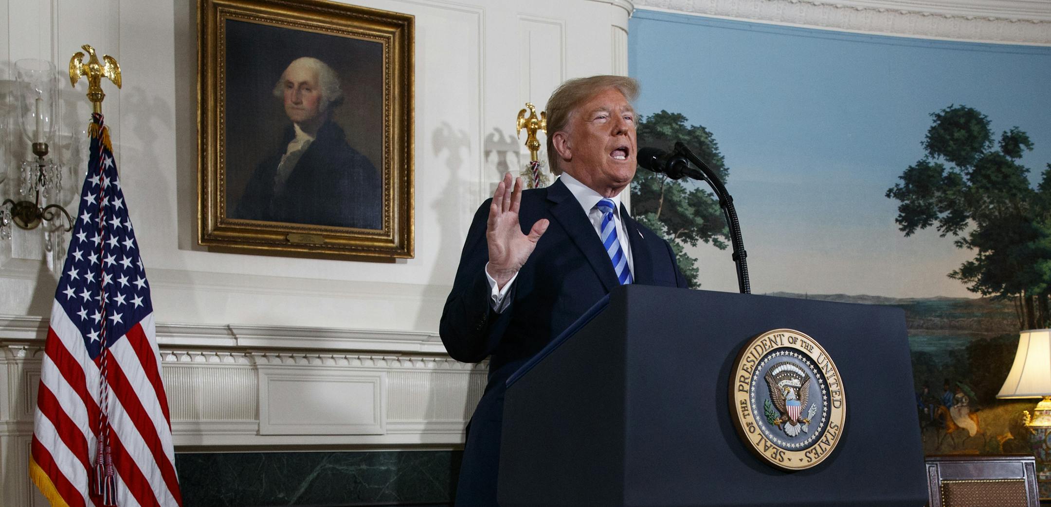 President Donald Trump delivers a statement on the Iran nuclear deal from the Diplomatic Reception Room of the White House, Tuesday, May 8, 2018, in Washington. Trump says the United States is withdrawing from the Iran nuclear deal, which he called "defective at its core."(AP Photo/Evan Vucci)