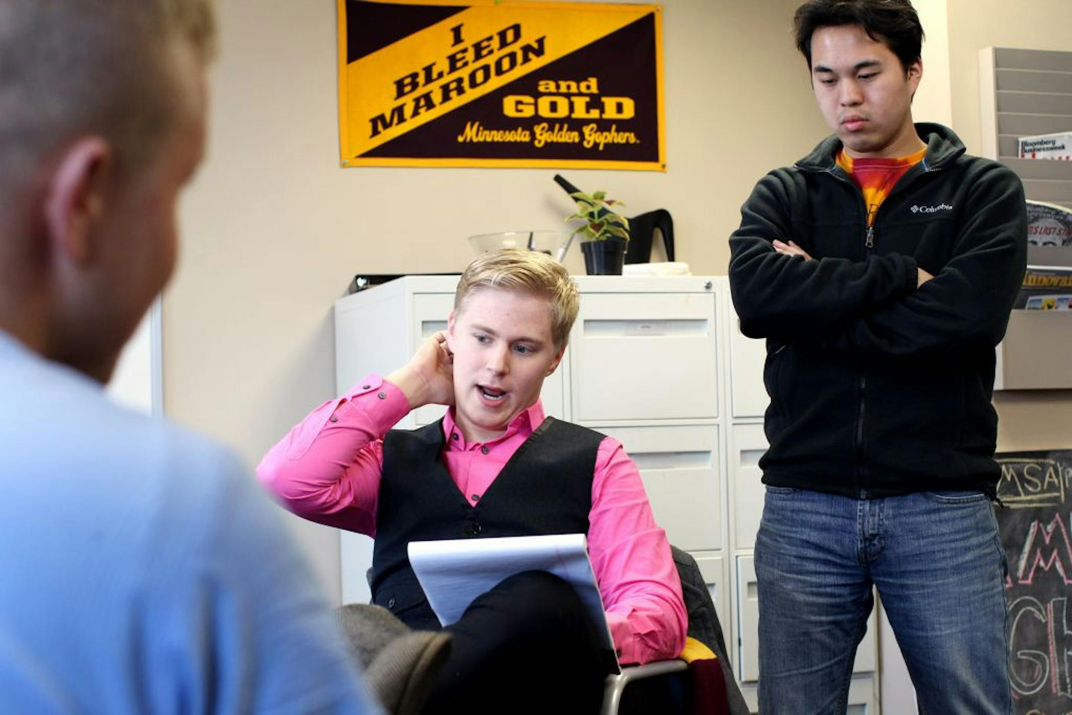 Question of access: Nate Schwab, left, and Andrew Stone discussed talking points for a legislative issue at the University of Minnesota in Minneapolis. Students will meet with the Board of Regents Friday to discuss the effects of rising tuition on enrollment.