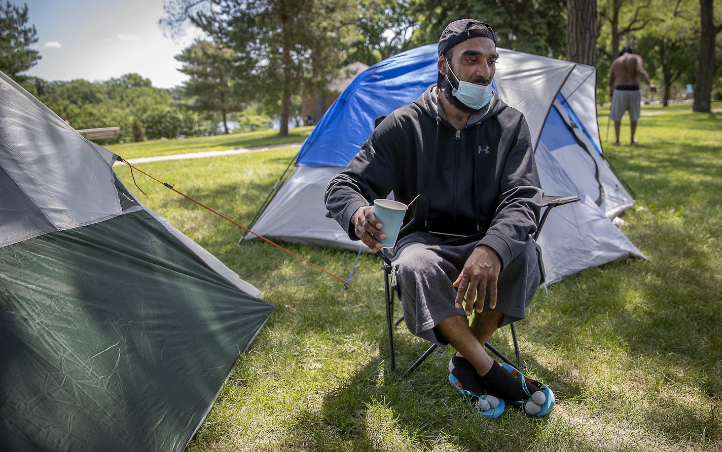 Dennis Barrow drank his coffee just outside his small tent at Powderhorn Park, Friday, June 12, 2020 in Minneapolis, MN. He and a small crowd of homeless people migrated to Powderhorn Park and pitched tents following the abrupt closure of the former Sheraton Hotel, which had become a sanctuary for the homeless amid the street protests last week. ] ELIZABETH FLORES • liz.flores@startribune.com