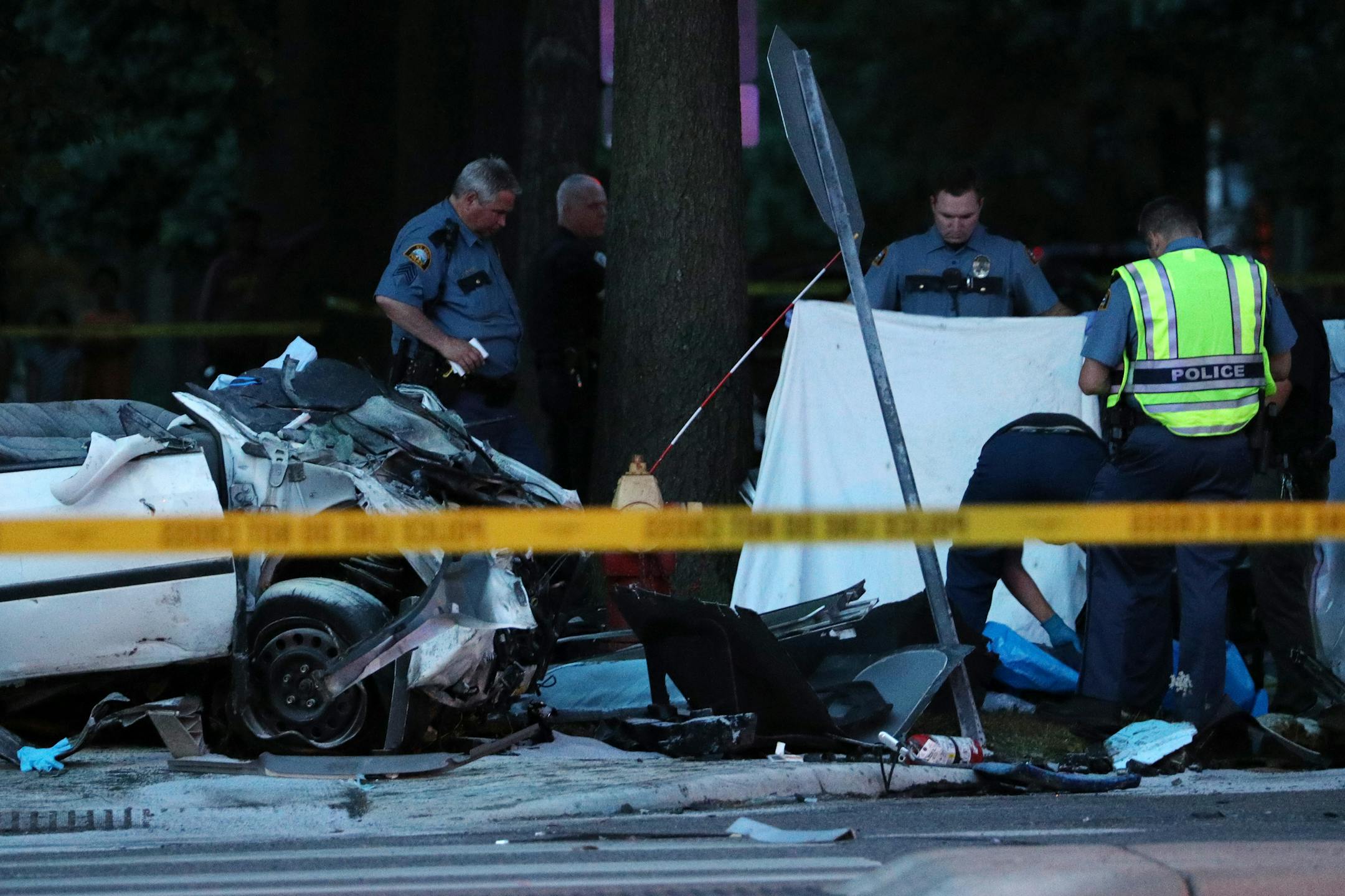 Police looked over the body at a fatal collision near the intersection of Dale Street North and Charles Avenue in St. Paul. ] ANTHONY SOUFFLE � anthony.souffle@startribune.com Police investigated the scene of a fatal collision between a car and bus Friday, July 21, 2017 near the intersection of Dale Street North and Charles Avenue in St. Paul, Minn.