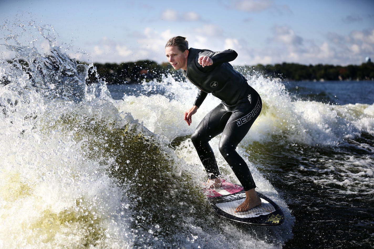 Stacia Bank, the current number one-ranked pro woman wake surfer practiced on Lake Minnetonka Monday September 15 , 2014 in Wayzata ,MN. Ten local wake surfers will compete Sept. 26-27 in a world competition. ] Jerry Holt Jerry.holt@startribune.com