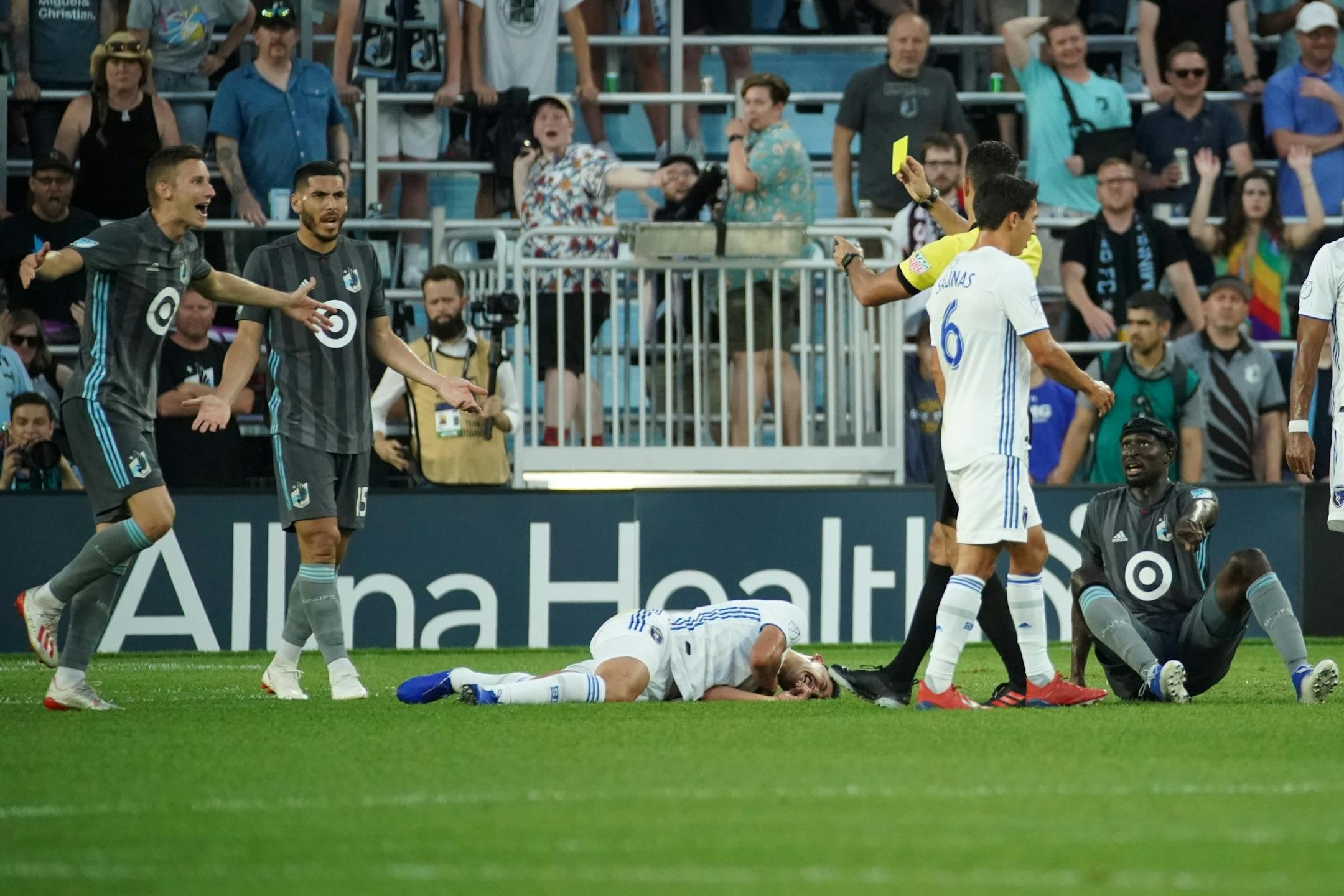 Minnesota United midfielder Jan Gregus (8) receiver a yellow card after fouling San Jose Earthquakes forward Cristian Espinoza (10) in the second half. The Minnesota United beat the San Jose Earthquakes 3-1.