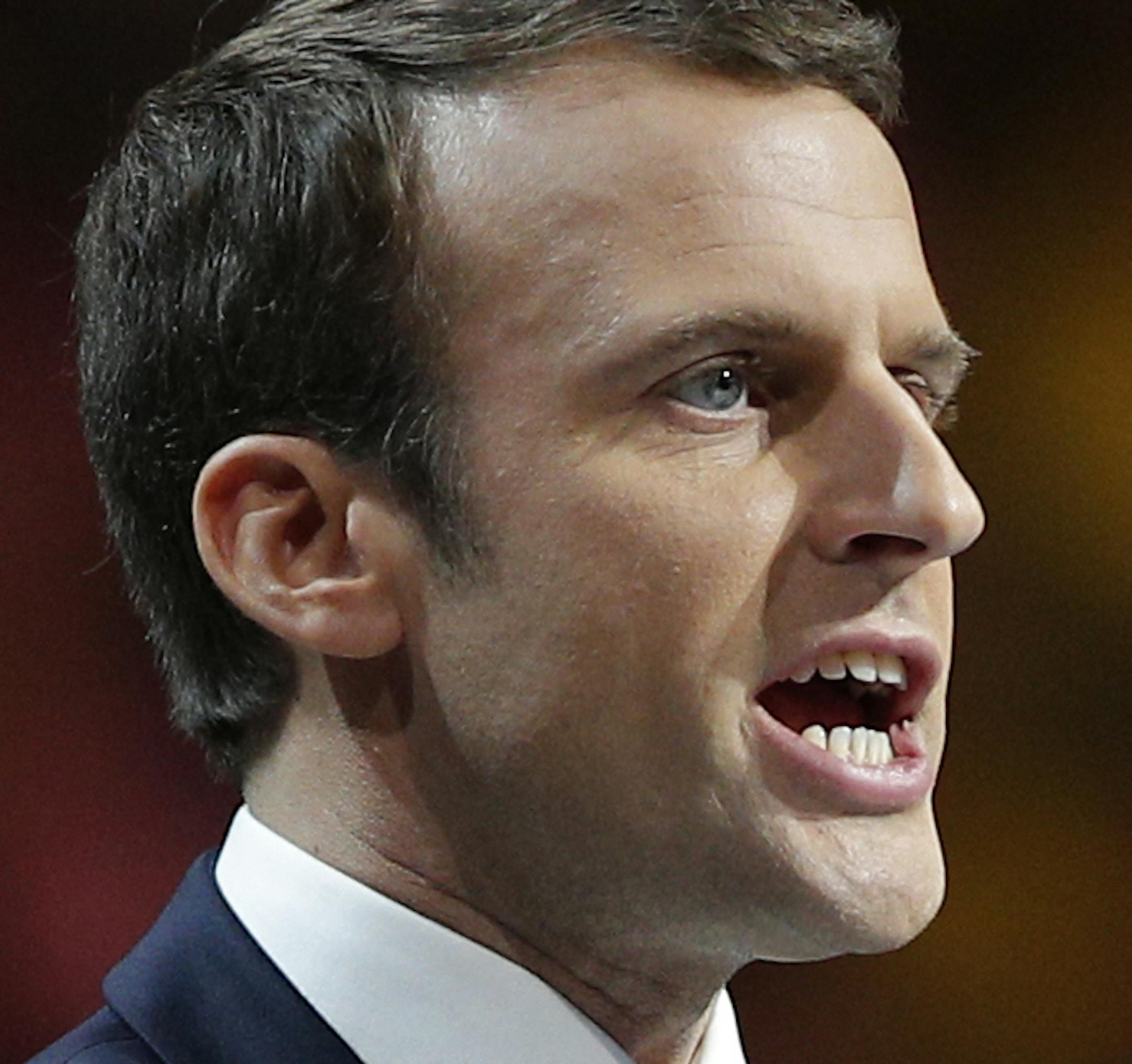 FILE - In this April 17, 2017 file photo, independent centrist presidential candidate Emmanuel Macron delivers a speech during a meeting in Paris. French centrist Emmanuel Macron is a newcomer in politics with strong pro-business, pro-European views that could make him France’s next president. Often described as unconventional and tenacious, the 39-year-old was unknown to the French people only three years ago. (AP Photo/Christophe Ena, File)