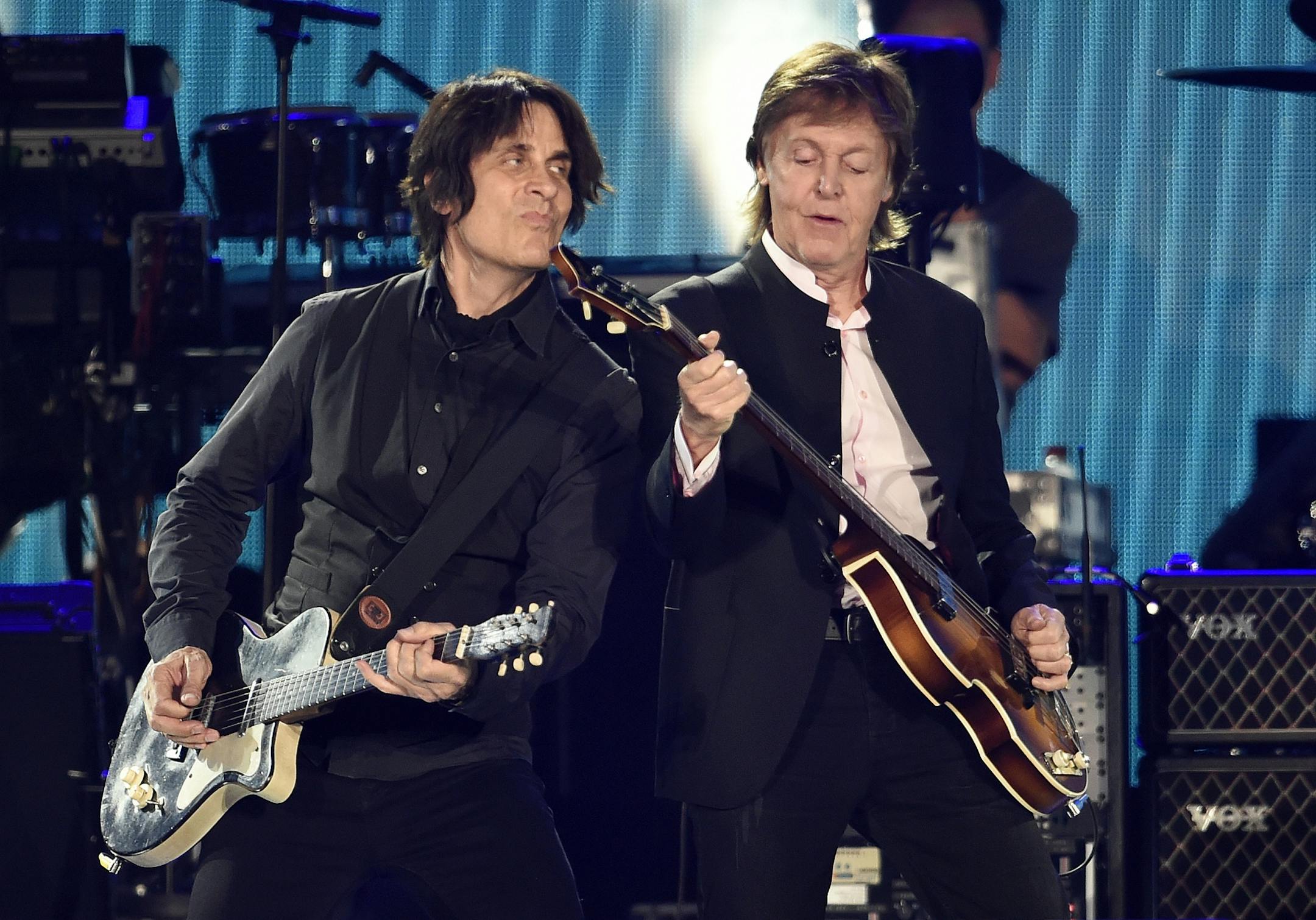 Paul McCartney, right, performs alongside guitarist Rusty Anderson during his performance on day 2 of the 2016 Desert Trip music festival at Empire Polo Field on Saturday, Oct. 8, 2016, in Indio, Calif.