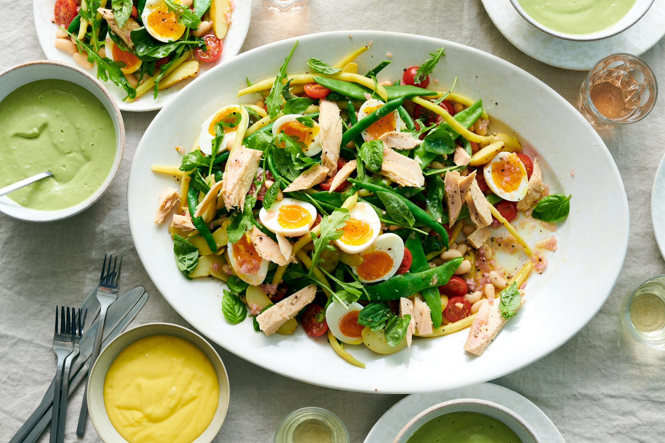 A Niçoise salad with summer vegetables. Preparing fresh beans can take some time, but you can simply use green beans and canned beans to speed up the process. Food Stylist: Simon Andrews (David Malosh/The New York Times)