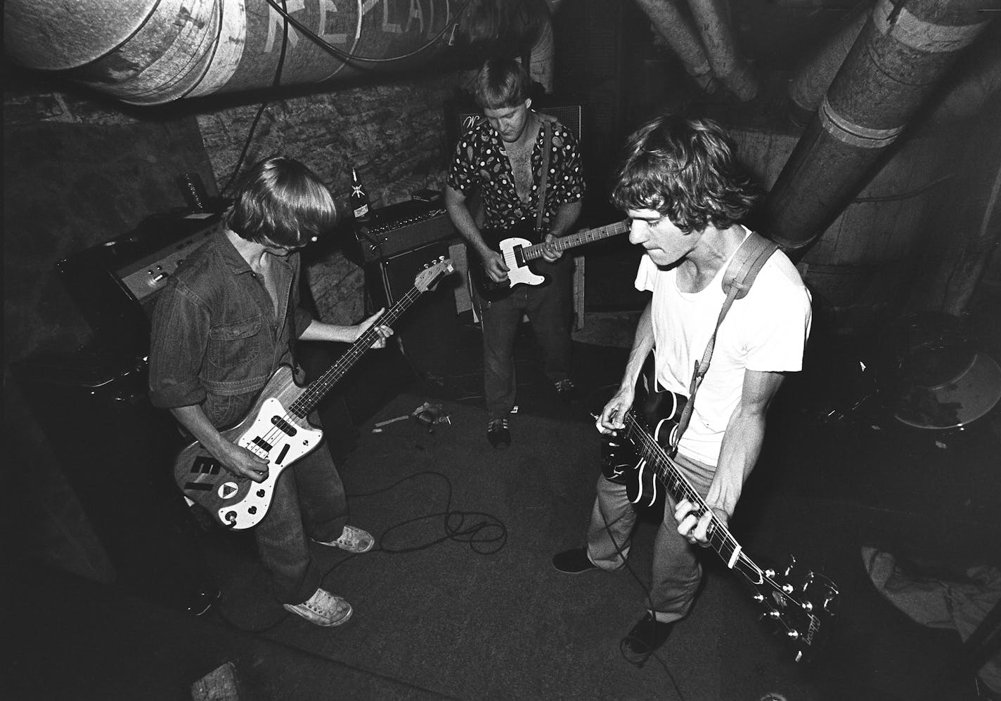 Tommy Stinson, left, Bob Stinson and Paul Westerberg rehearse in the Stinson family's basement near the start of the Replacements' run around 1980.