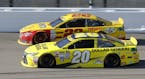 Sprint Cup Series driver Joey Logano (22) and Matt Kenseth (20) run side-by-side during a NASCAR auto race at Kansas Speedway in Kansas City, Kan., Su