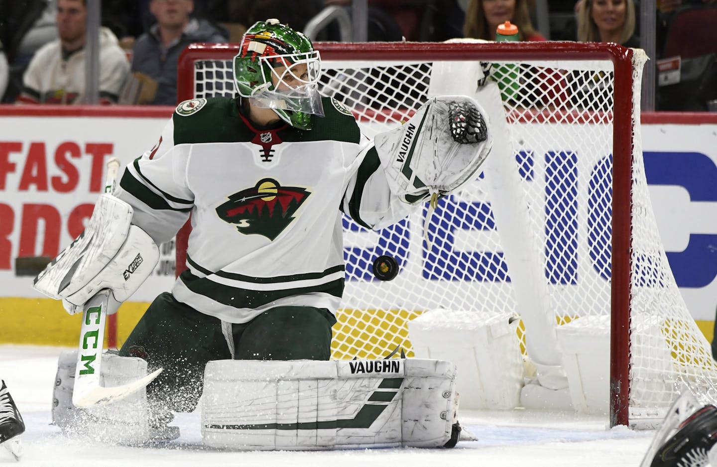 Minnesota Wild goalie Kaapo Kahkonen (31) of Finland, misses a goal scored by Chicago Blackhawks' David Kampf during the second period of an NHL hockey game Sunday, Dec. 15, 2019, in Chicago. (AP Photo/Paul Beaty)