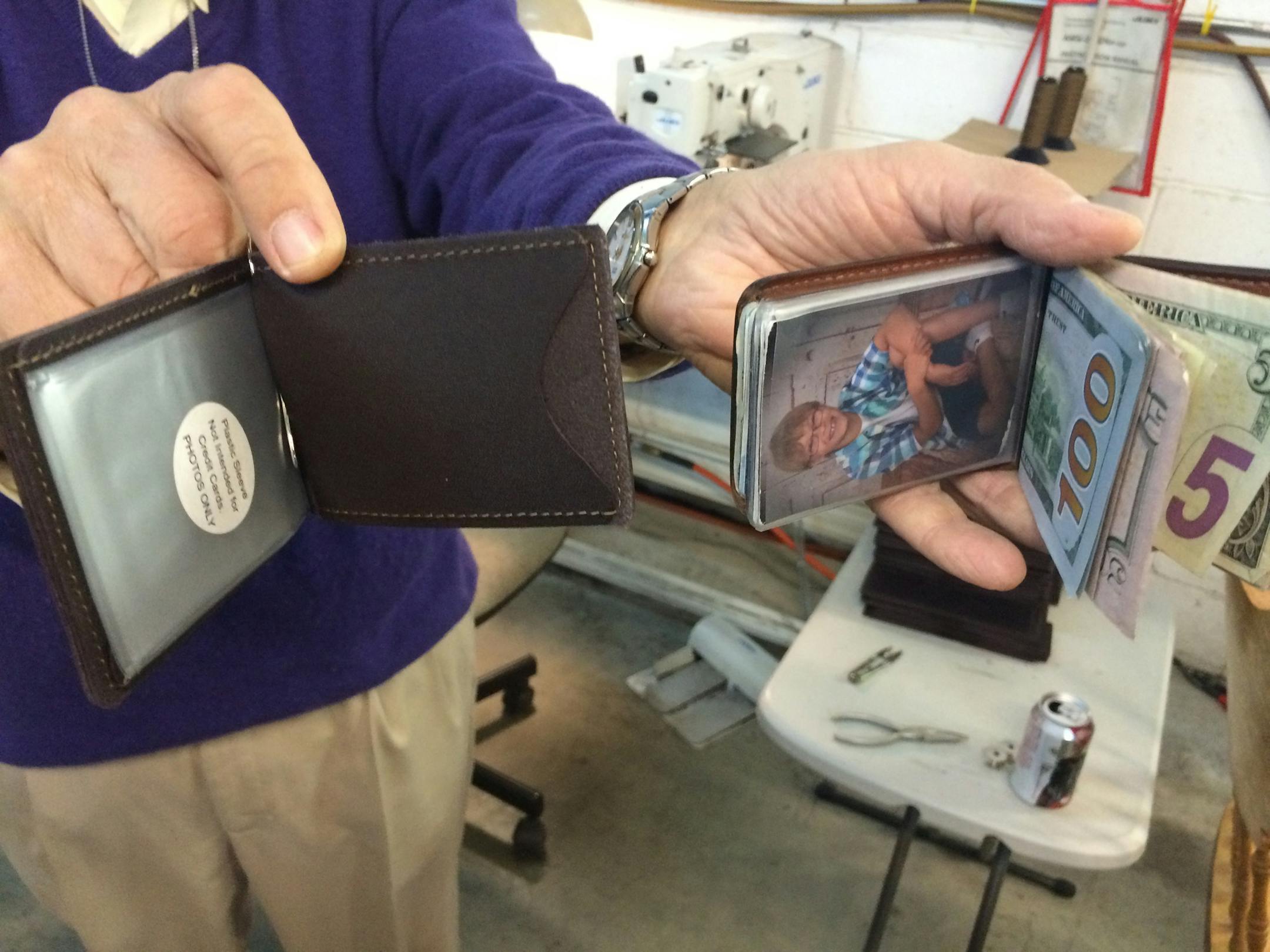 Vlad Gribovsky, owner of leather-accessories manufacturer TPK of Waconia, displays empty and full version of his "Back Saver Wallet." He has taken on giants Google and Staples for unauthroized use of his patented-and-trademarked wallet in their online advertising. Photo by Neal.St.Anthony@startribune.com