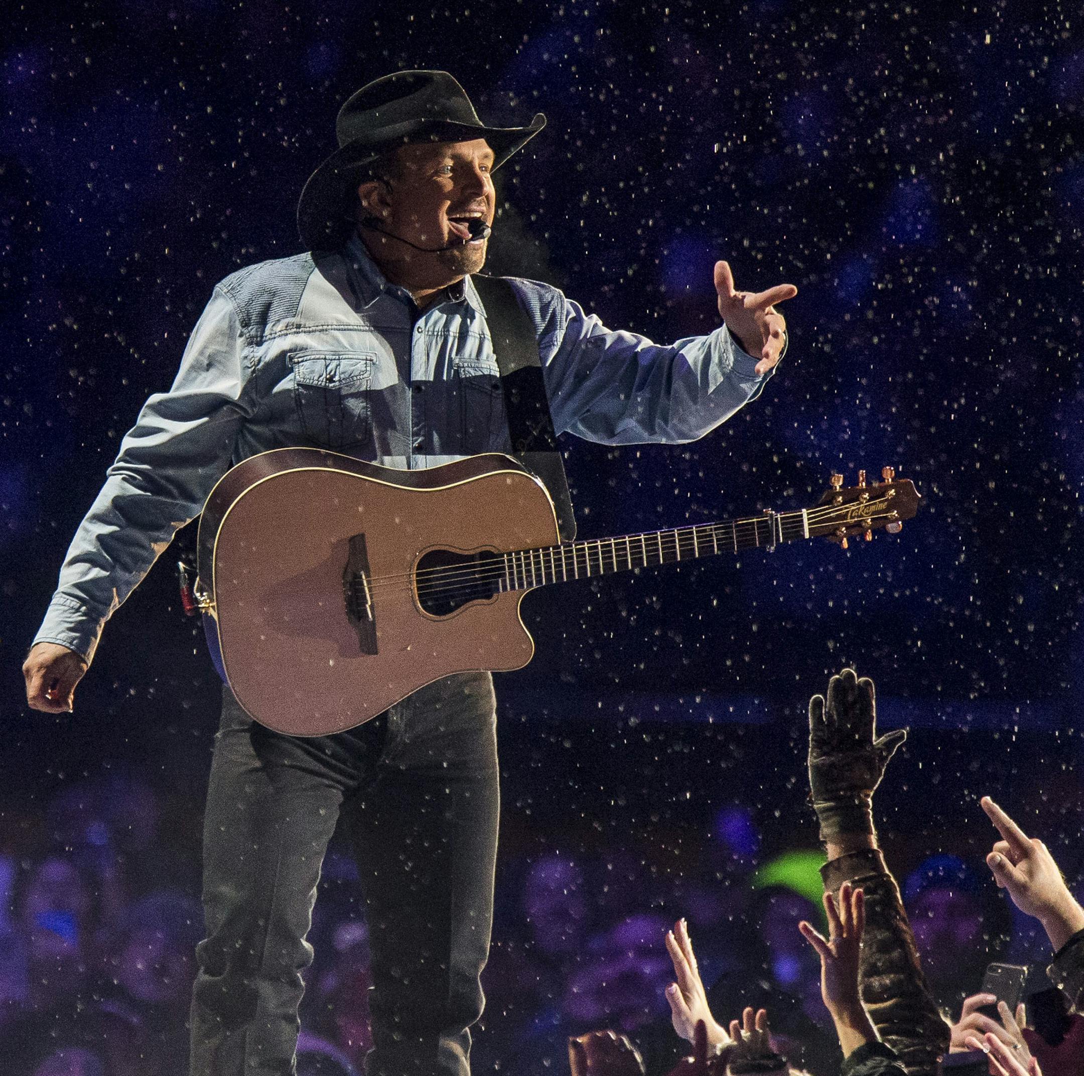 Garth Brooks performs before a sold-out crowd at Notre Dame Stadium Saturday, Oct. 20, 2018, in South Bend, Ind. (Robert Franklin/South Bend Tribune via AP)