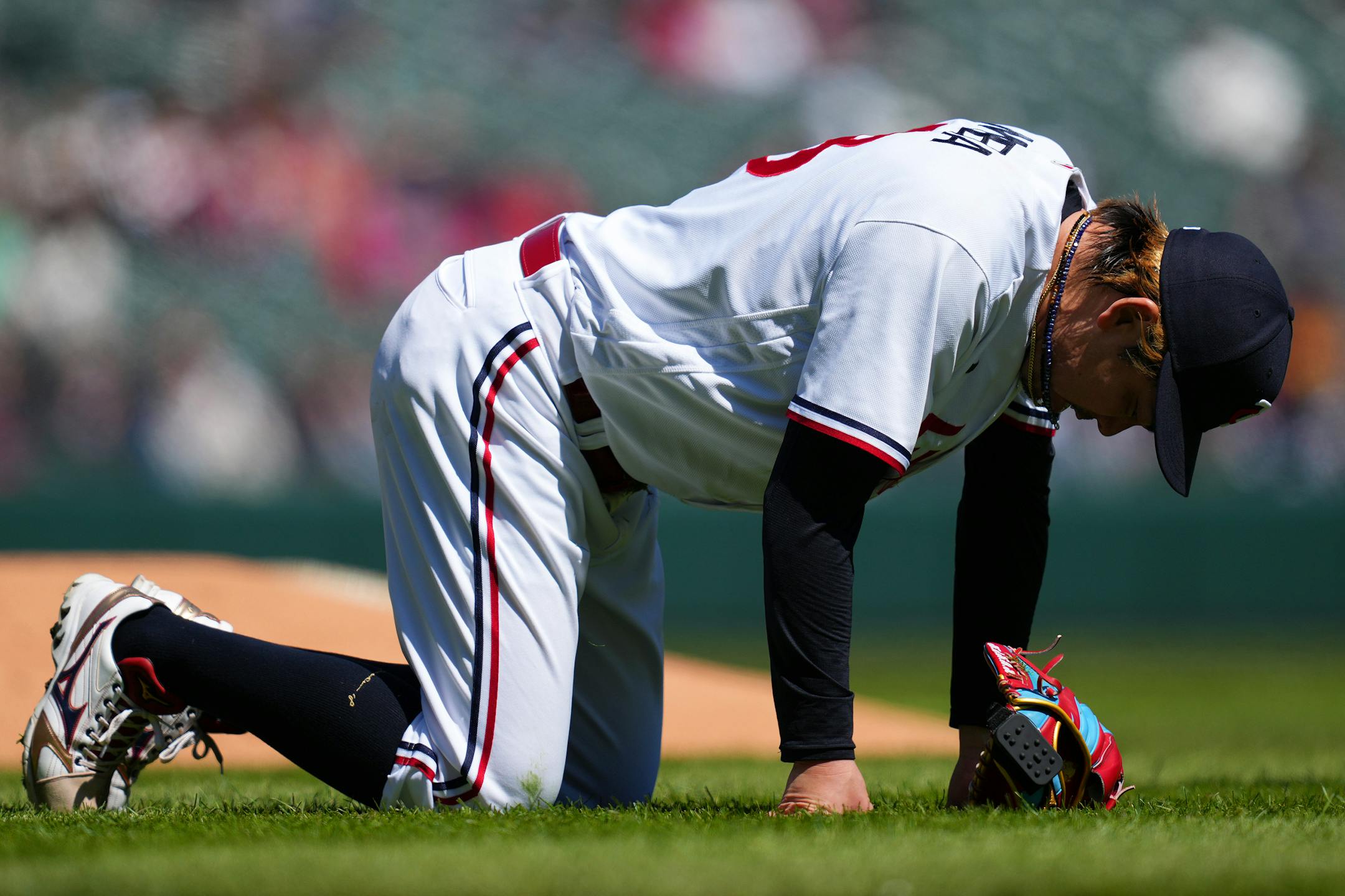 Minnesota Twins starting pitcher Kenta Maeda (18) is slow to get up after trying to field a single hit by New York Yankees center fielder Isiah Kiner-Falefa (12) in the second inning.